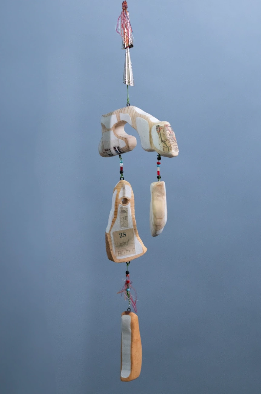 Detail of "Trail Shawl" — Wood, wire, beads, jingles, paint